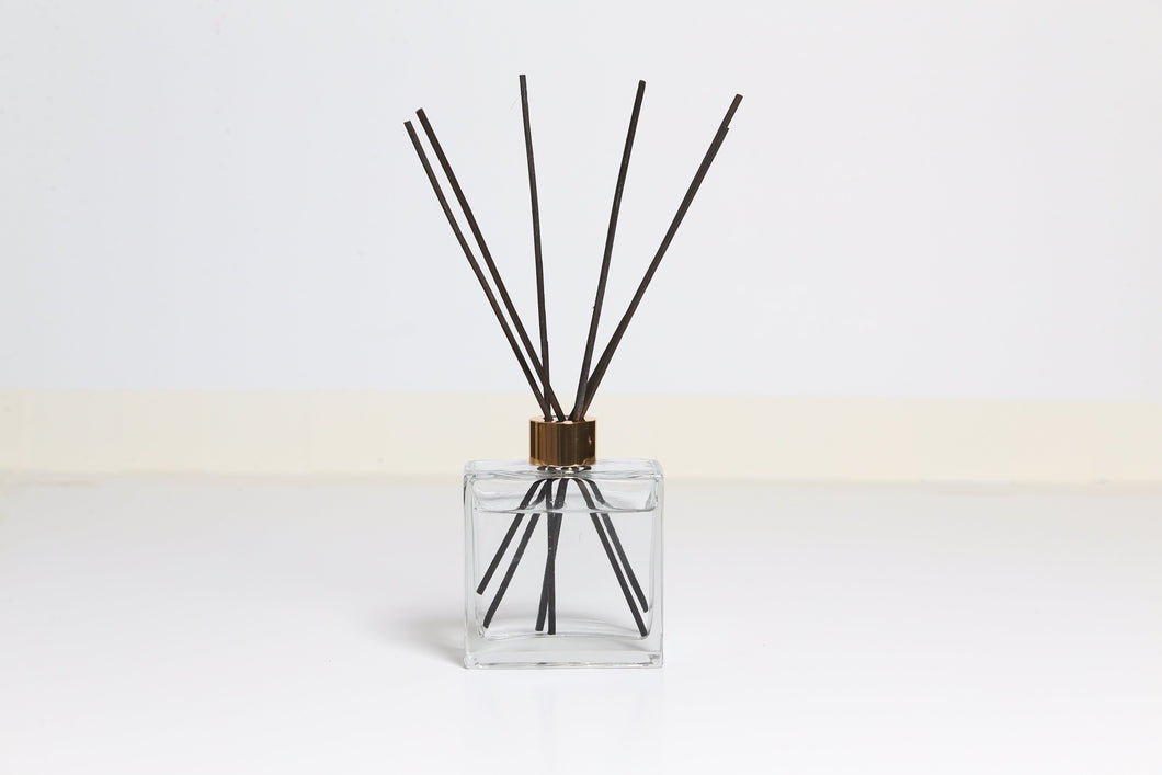 Black reed diffuser with white background