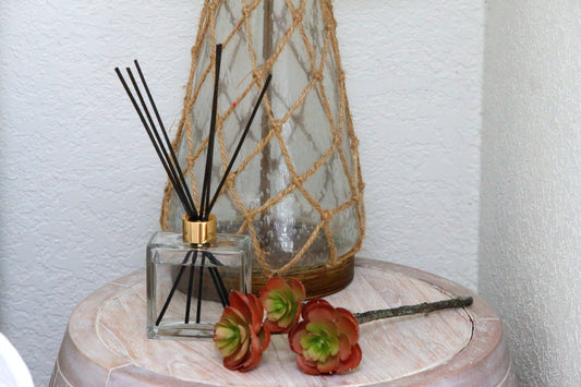Black reed diffuser on bedside table 
